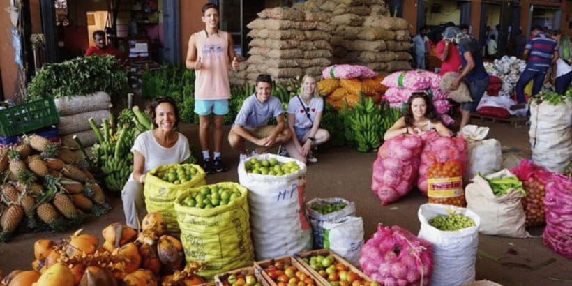 Colombo: Local Market Tour & Cooking Demo with Lunch - Choosing produce at a real Sri Lankan market